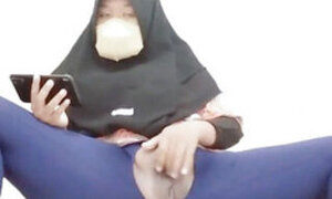 Indonesian hijab aunt wearing cucumber