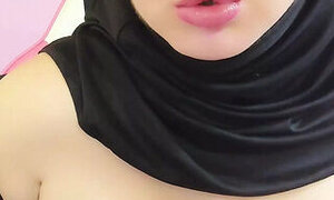 My stepsister in a hijab undresses my brother-in-law on camera