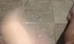 Masturbating in the shower with my toy.