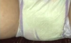Wifey peeing in her diaper after giving me a blowjob