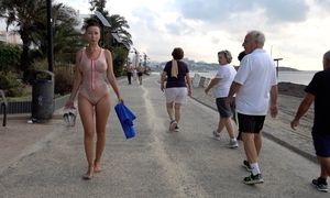 Humid translucent bathing suit in public