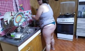 Mom cleans her kitchen