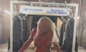 Hot Blonde gets dared to get naked in a moving car wash