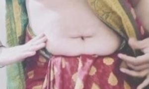 Indian Mature Aunty is wearing saree and showing big boobs and hairy wet pussy