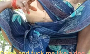 Asking pleasure outdoor in the farm sitting wearing saree .