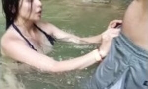 I'm in the river with my stepbrother, he convinces me to give him a wonderful blowjob