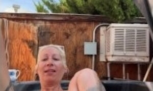 Piss Slut floating in her hot tub and pissing like a fountian!!