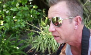 Blonde MILF Kristal Summers sees her gardener outdoors working in the backyard so, she...