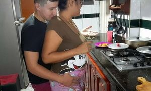 My stepmother gives me a rich blowjob in the kitchen.