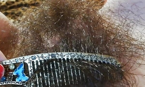 Hairy pussy fetish brushing the bush closeup