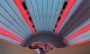 HOT MILF PLAYS WITH PUSSY IN TANNING BED