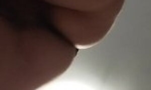Sexy Latina nude in the kitchen. Sexy naked wife prepares food in the kitchen