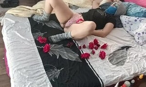Amateur couple foreplay in the bedroom.